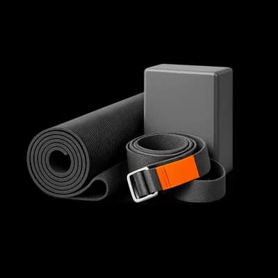 Portrait arrangement of yoga props representing studio continuity and retention